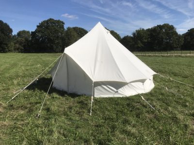 White bell tent in field